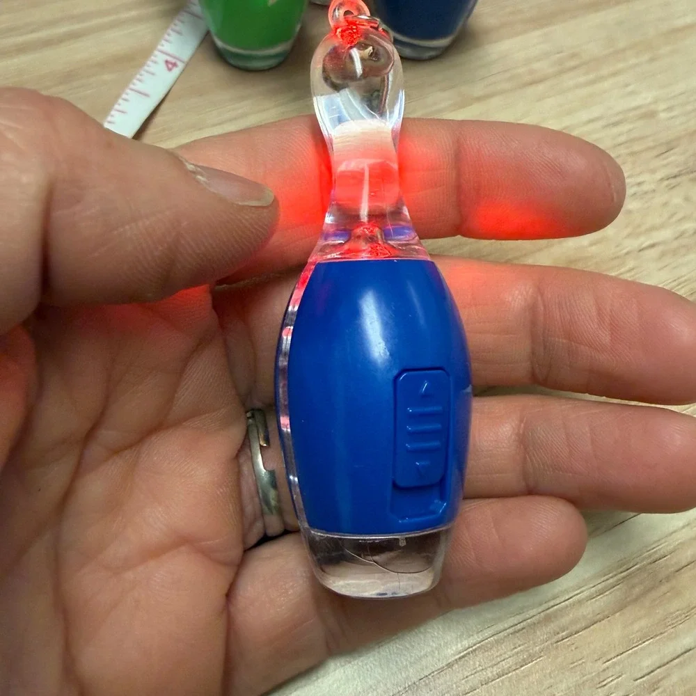 Set of 4 Bowling Pin Light Up LED Keychains Blue Green Orange Novelty